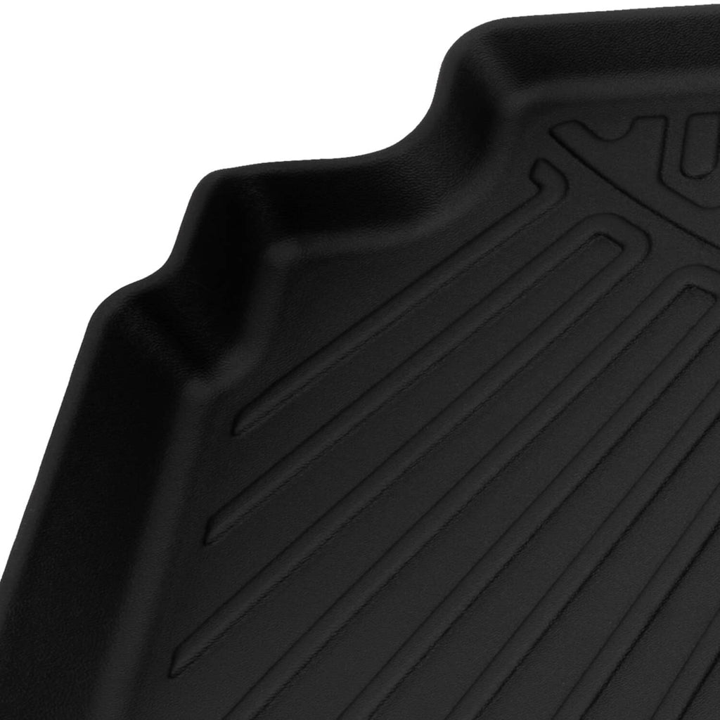 Black floor mat corner with raised tread ridges and contoured raised edges