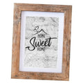 Rustic brown wood photo frame with white mat, holding a 4x6-style print