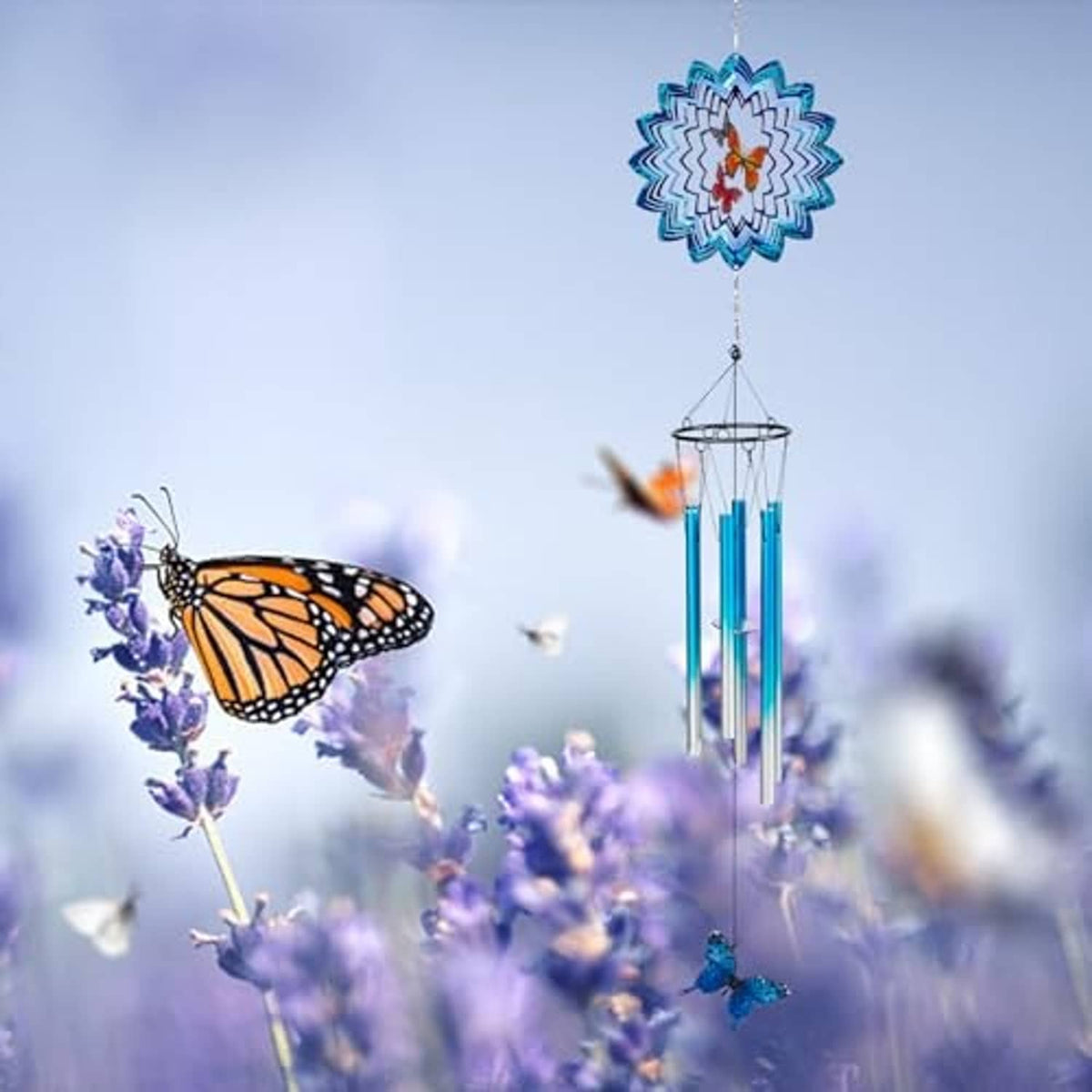 Blue butterfly wind chime with 3D blue flower topper and multiple hanging metal tubes