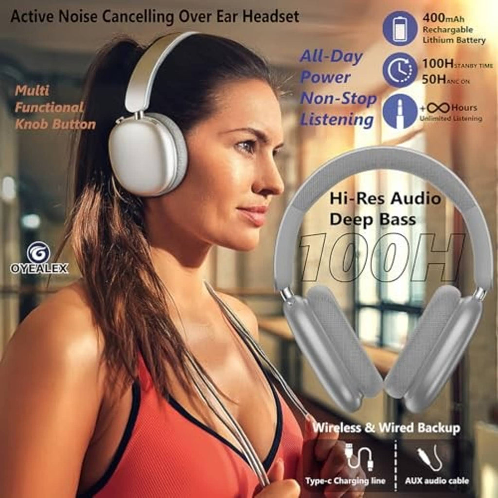 Silver over-ear headphones worn by a woman, with padded earcups and headband