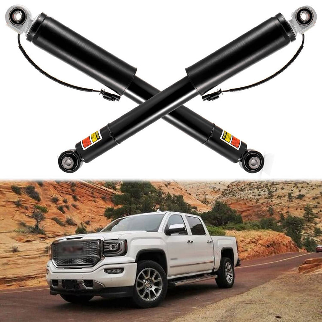 Set of two black rear shocks crossed view with top and bottom mounting hardware
