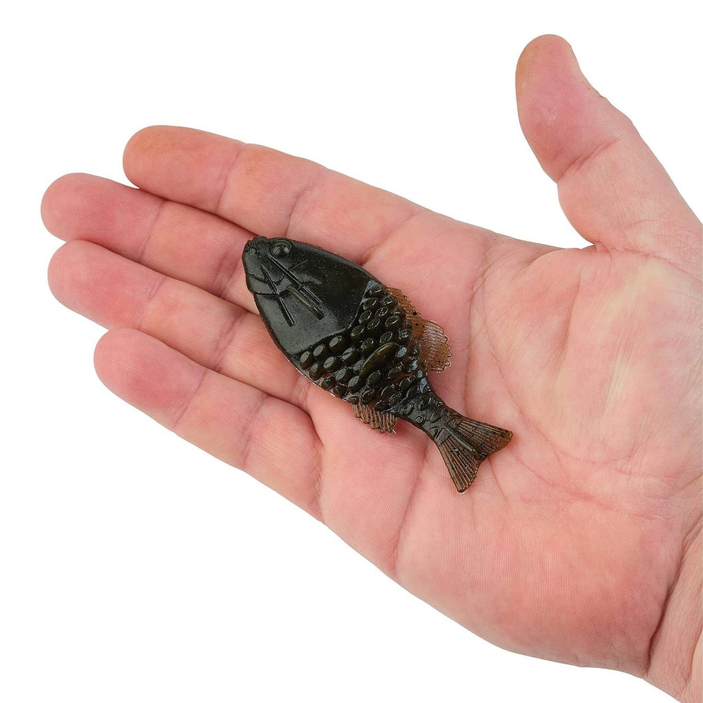 Green pumpkin gilly fishing lure in palm, dark back with golden speckle