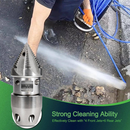 Stainless steel sewer jetter nozzle spraying water from a pressure washer