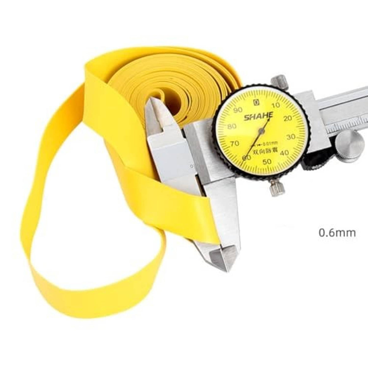 Yellow puncture protection tape measured with caliper; approx 0.6 mm thickness