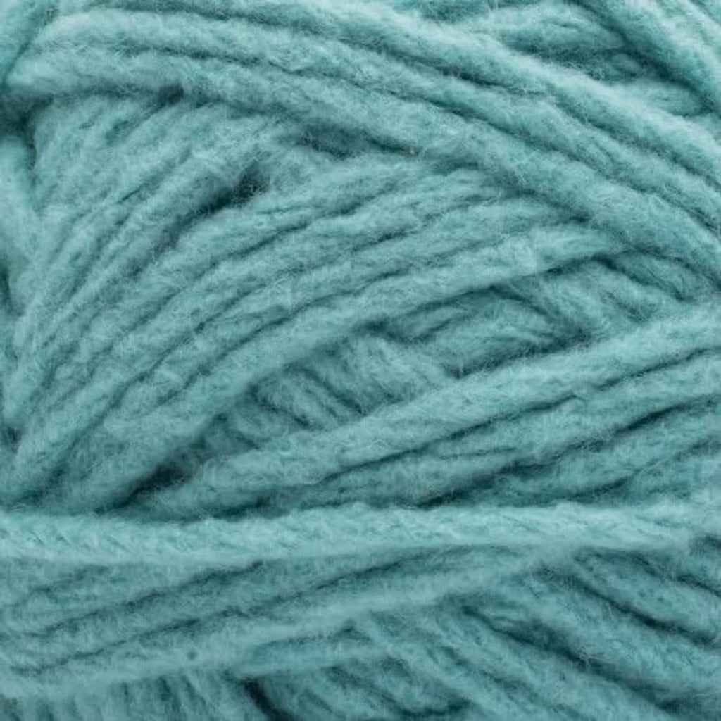 Close-up of teal yarn texture with soft, twisted super bulky strands