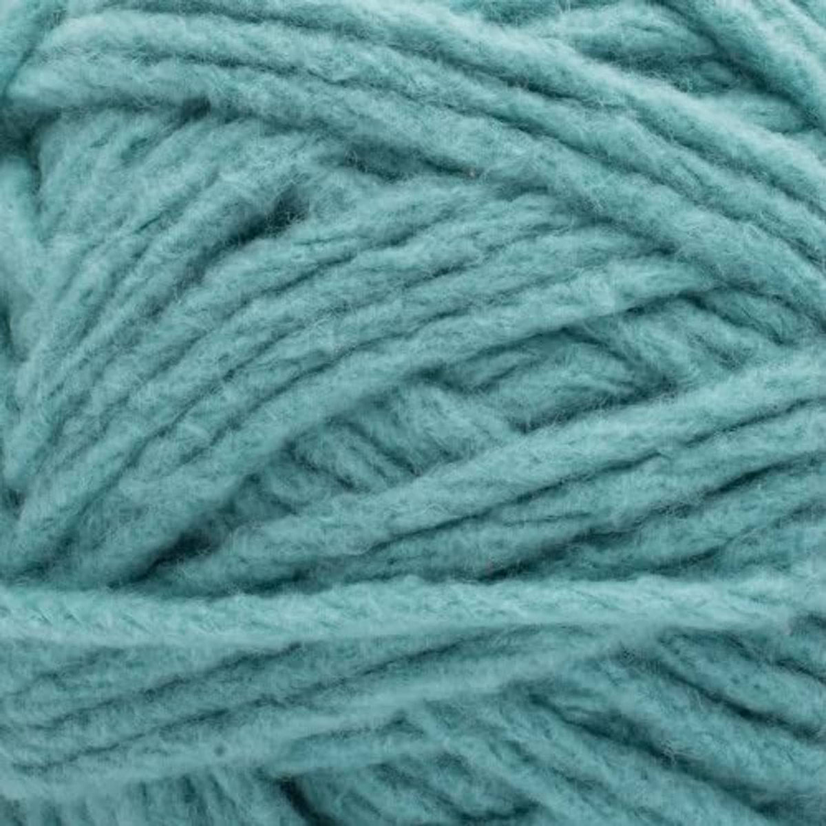 Close-up of teal yarn texture with soft, twisted super bulky strands
