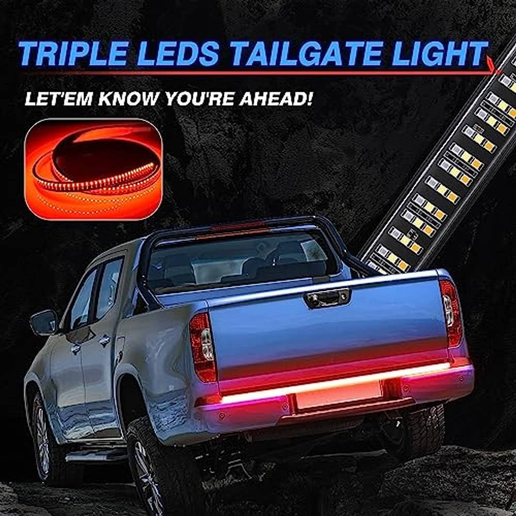 Installed tailgate LED light bar with bright red glow on pickup truck