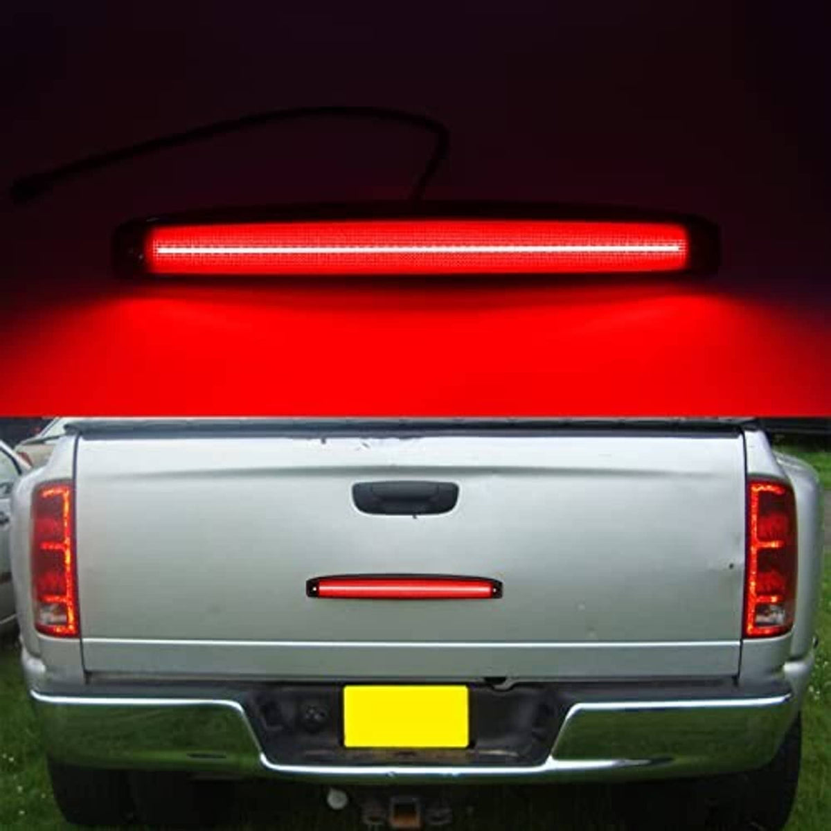 Smoked red LED tailgate light bar glowing red, black housing