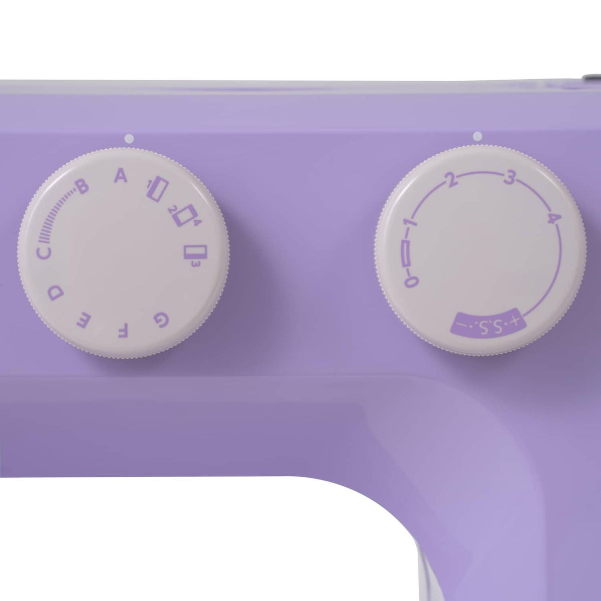 Close-up of purple Janome sewing machine tension and stitch pattern dials
