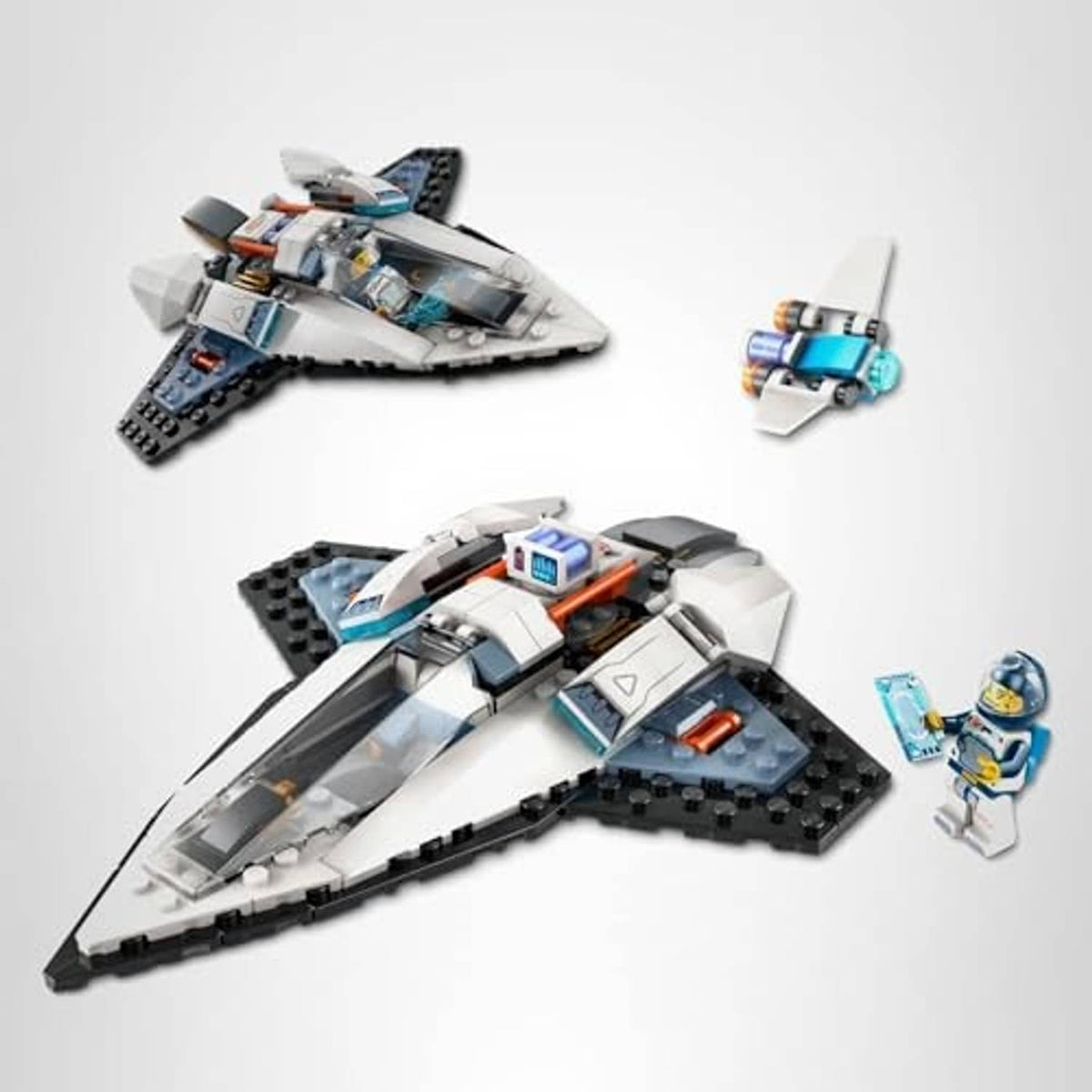 LEGO interstellar spaceship toy with astronaut minifigure and small blue drone accessory