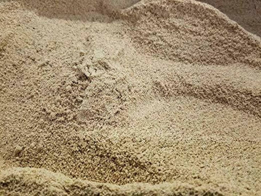 Close-up of fine light-brown espresso coffee grounds