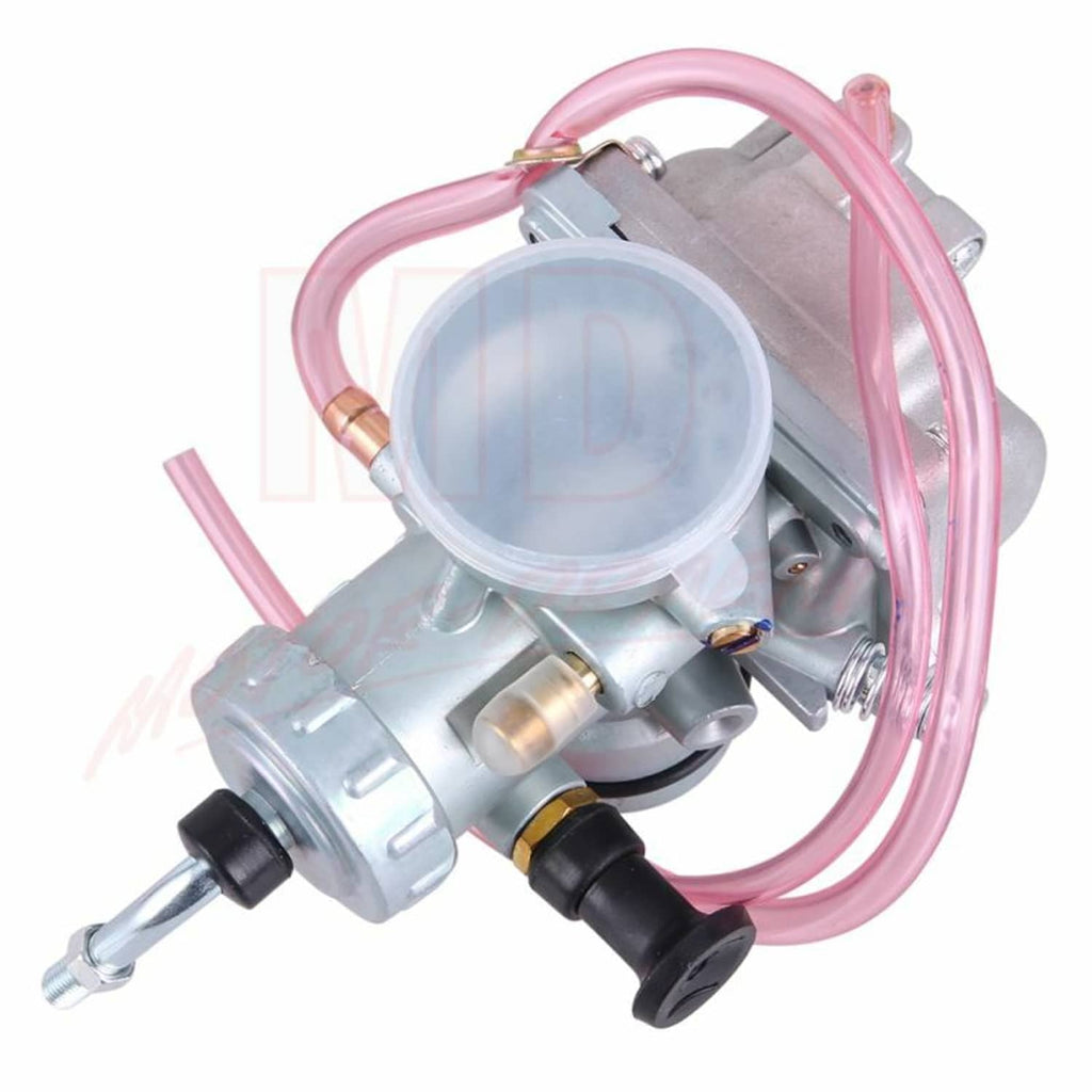 Silver carburetor with clear diaphragm cover and pink fuel hoses, side view