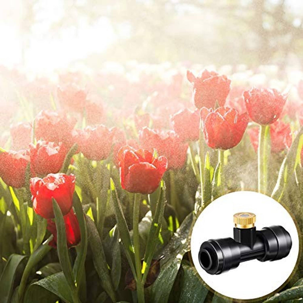 Misting nozzle tee with brass cap emitting fine spray over plants