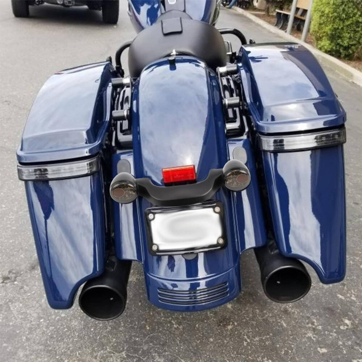 Rear turn signal brake light bar installed on blue motorcycle with two smoked lamps