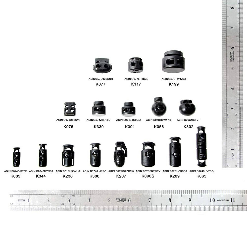 Assorted black cord lock spring stopper ends shown with size ruler