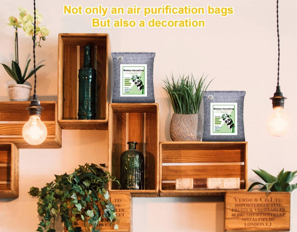 Set of grey cloth odor absorber bags with metal grommets and printed labels.