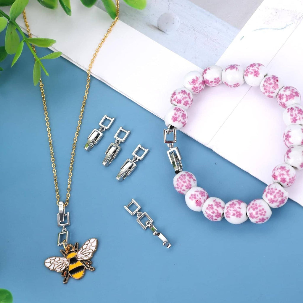 Silver fold-over clasp extender set with chain clips and pink bead bracelet