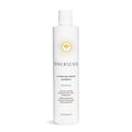Innersense Hydrating Cream Hairbath shampoo bottle, white with pump and gold logo