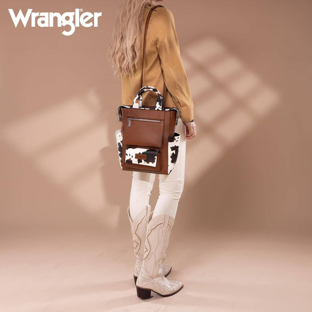 Cow-print vegan leather backpack purse with Wrangler patch, front zip pocket, top handles