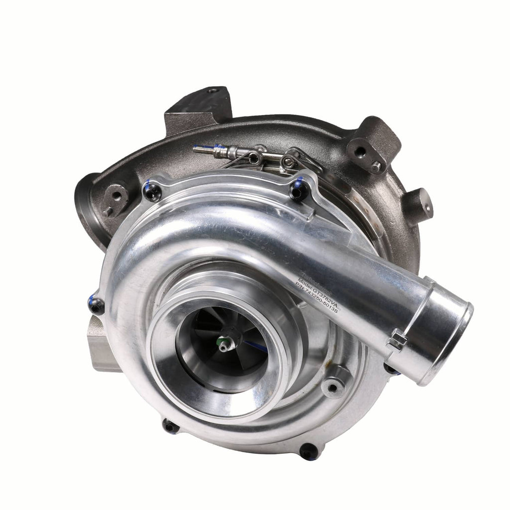 Turbocharger with round compressor inlet and curved metal exhaust housing