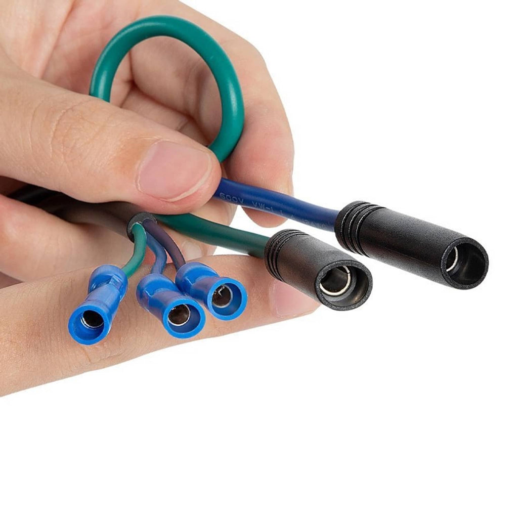 Close-up of hand holding relay harness ring terminals and blue spade connectors on wires