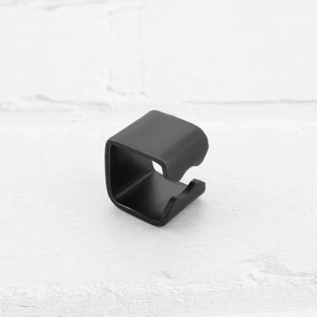 Black rubber trolley jack link clip with side pin notch and open slot