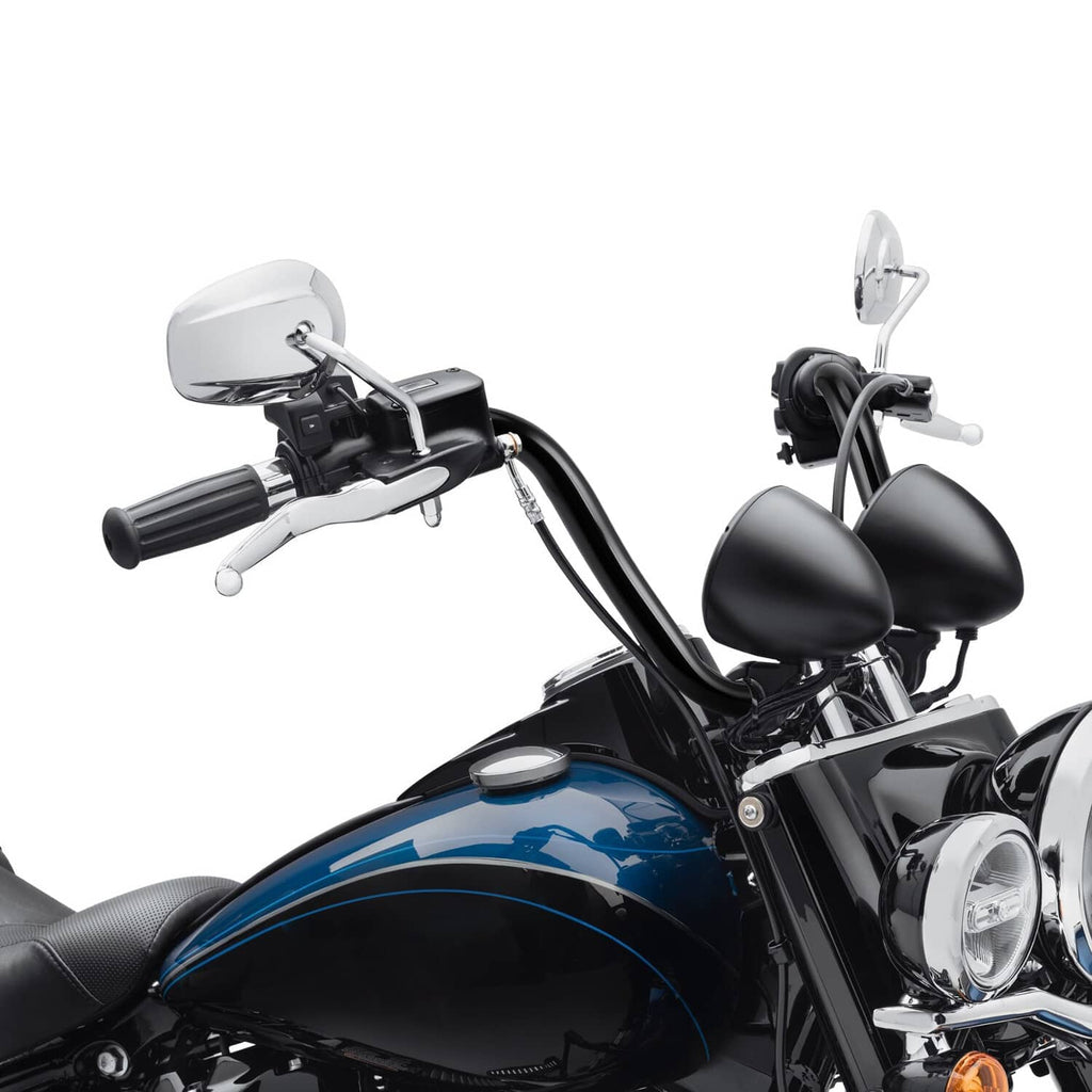 Black ape-hanger handlebars mounted on a cruiser motorcycle with controls and levers