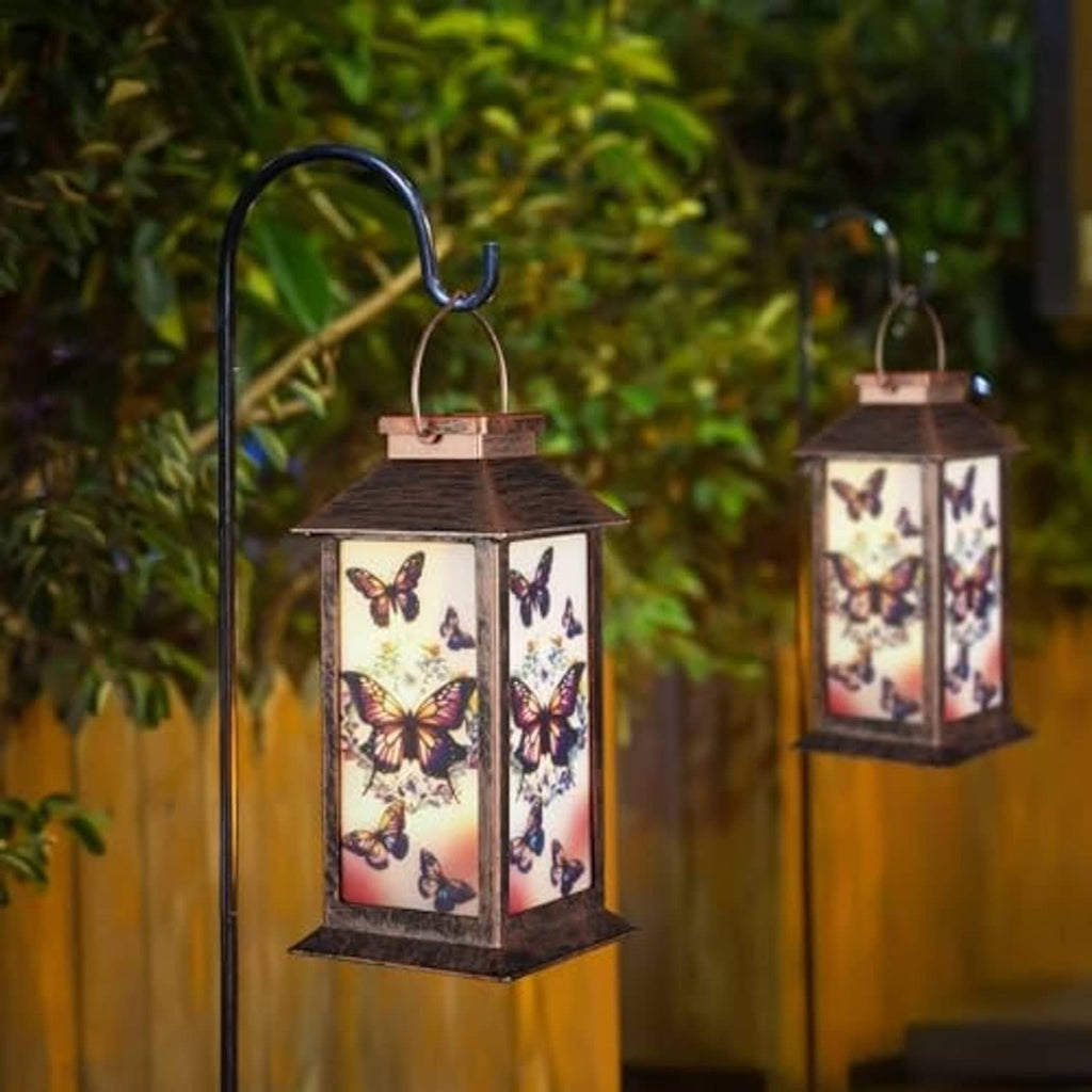 Set of two hanging solar butterfly lanterns with copper frames and window panels