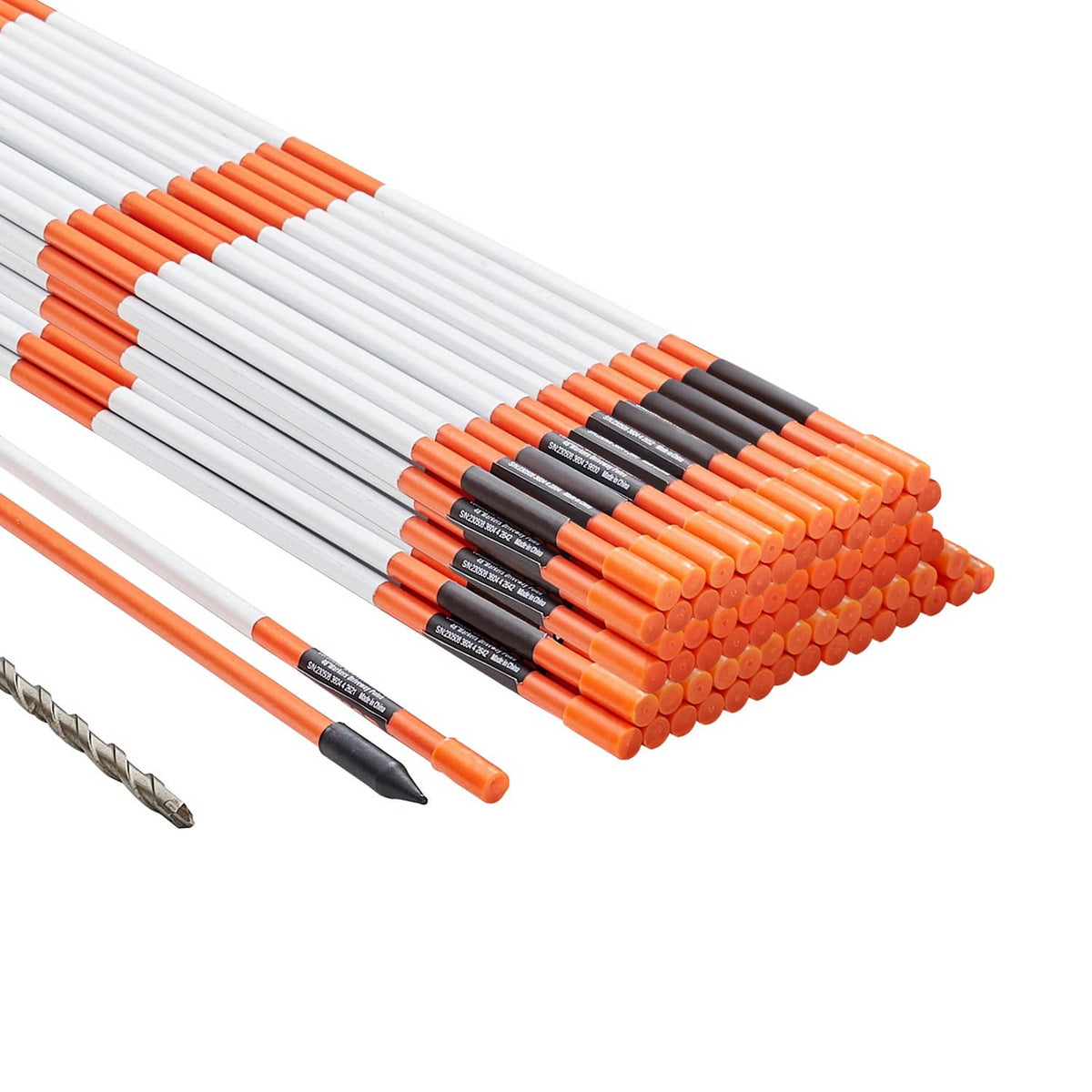Stack of orange-and-white driveway markers with pointed ends and black tip caps