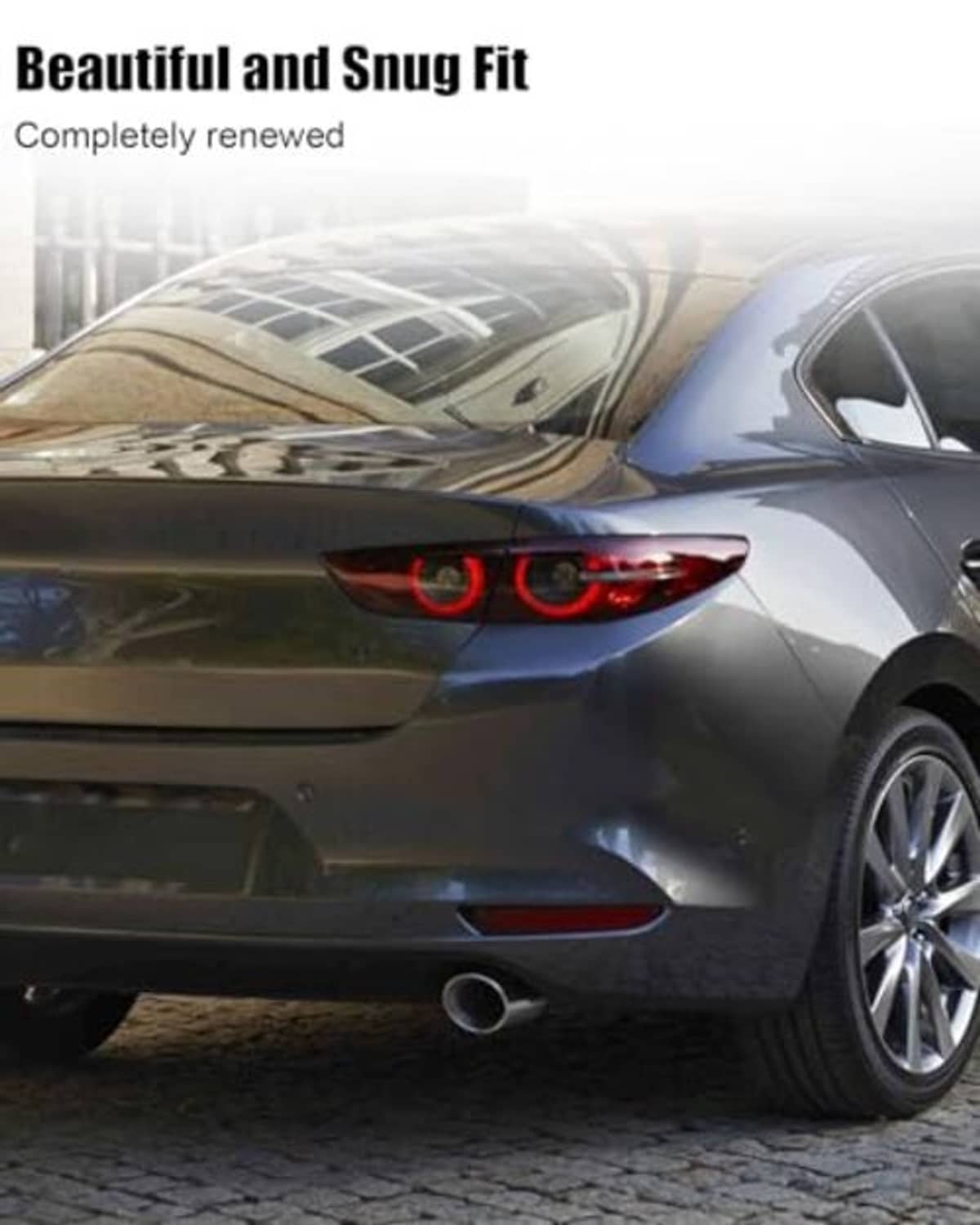 Black bumper towing cover installed on a sedan rear bumper over the tow opening.