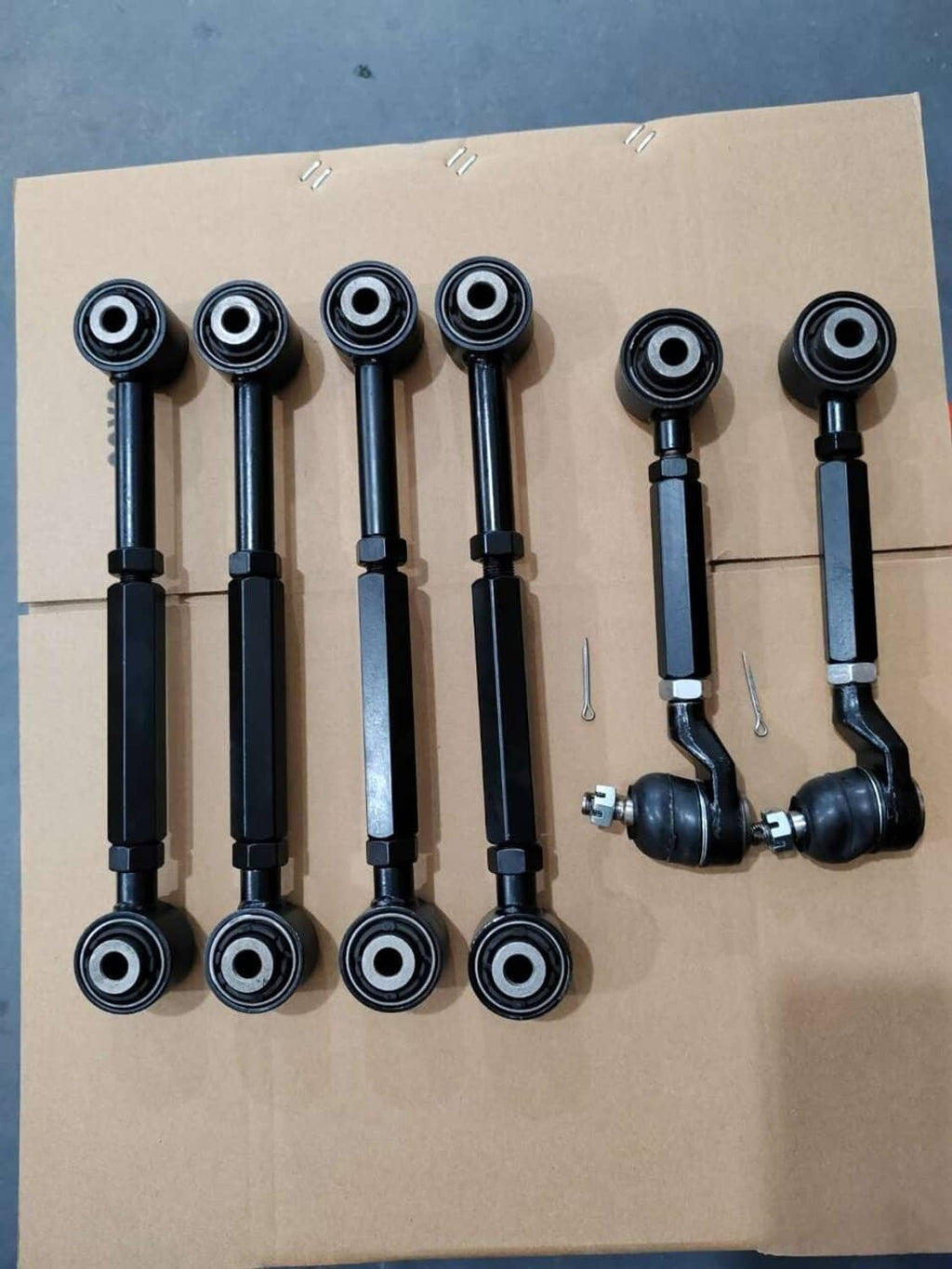 Set of six black rear camber control arms with bushings and round bearings
