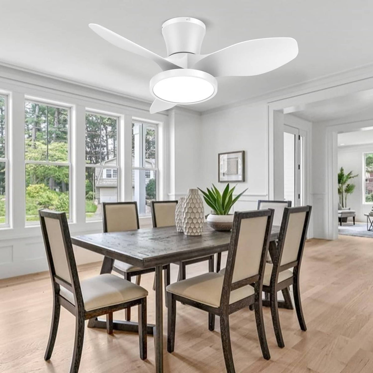 White ceiling fan with LED light above a dining area