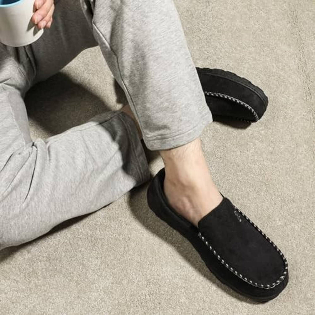 Black moccasin house slippers with contrast stitched edges and cushioned lining