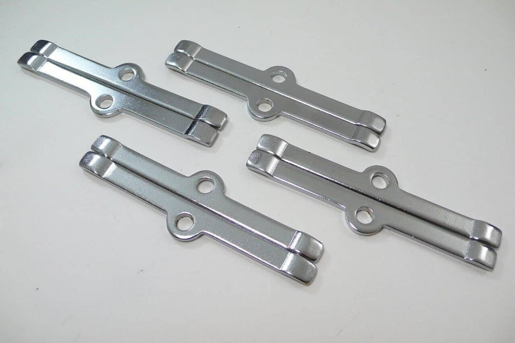 Chrome spreader bars with oval mounting holes for valve cover hold-down