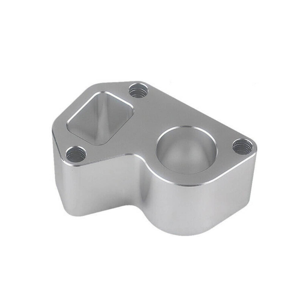 Silver water pump spacer block with circular opening and threaded mounting holes