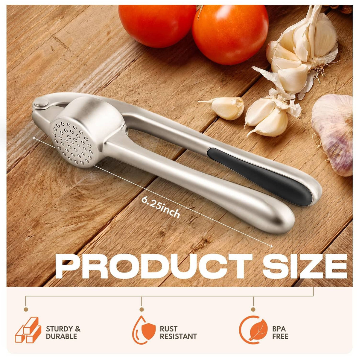 Stainless steel garlic press with black handles and press cup, on wooden cutting board