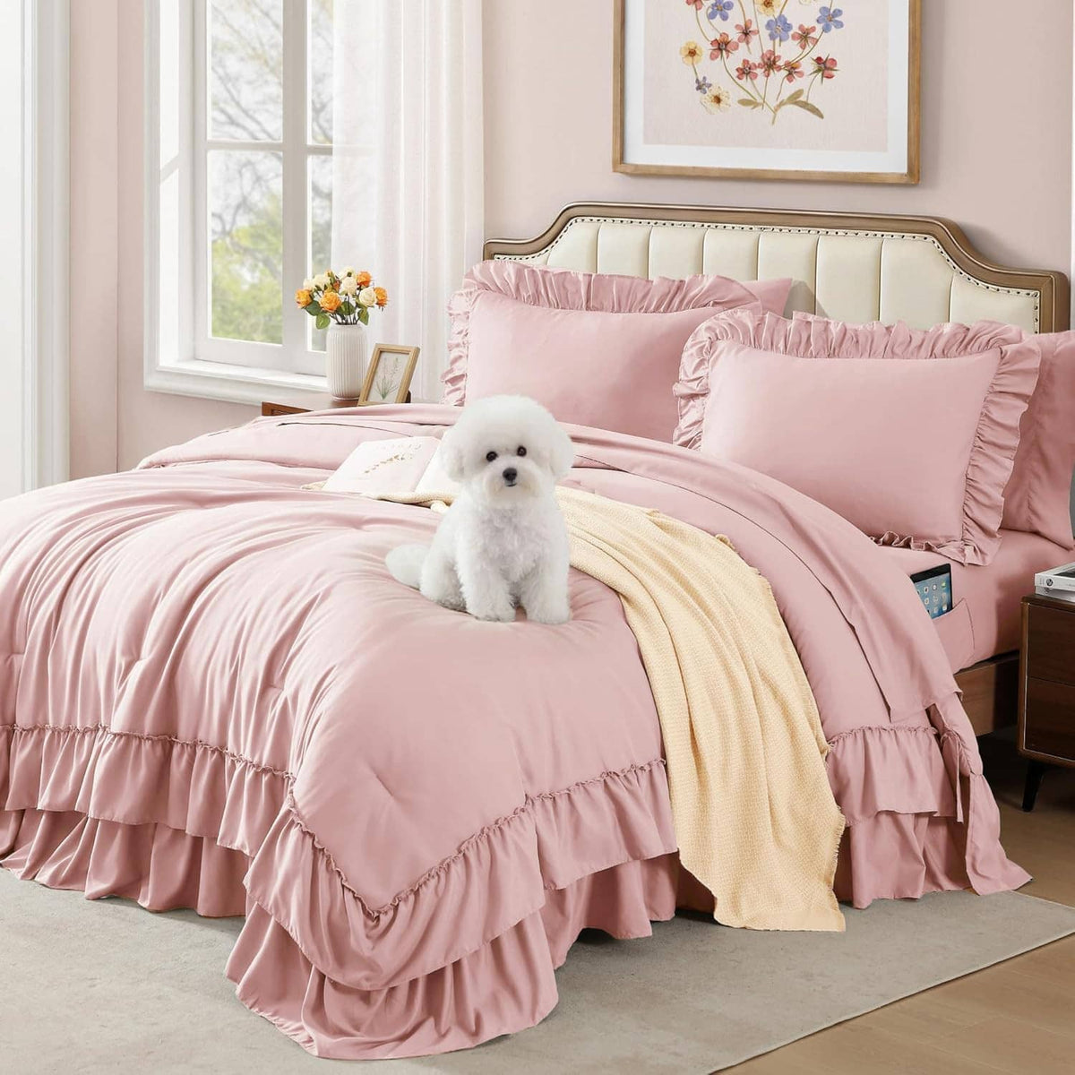 Pink queen comforter set with layered ruffle bedding and two shams, with dog on bed