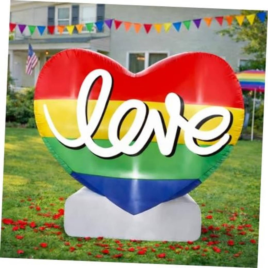 Inflatable Pride heart decoration with 'Love' script, rainbow colors, on white base