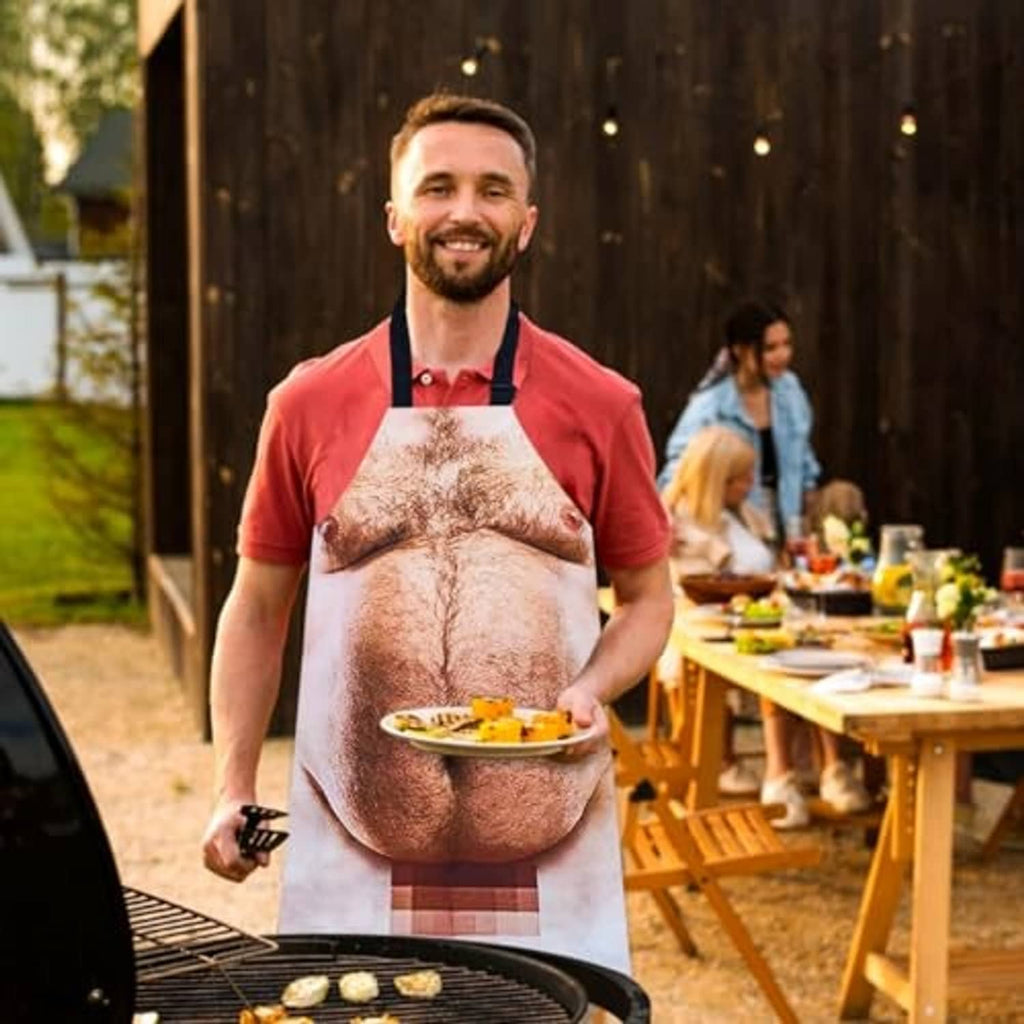 Funny novelty grilling apron worn while grilling outdoors, printed male torso design