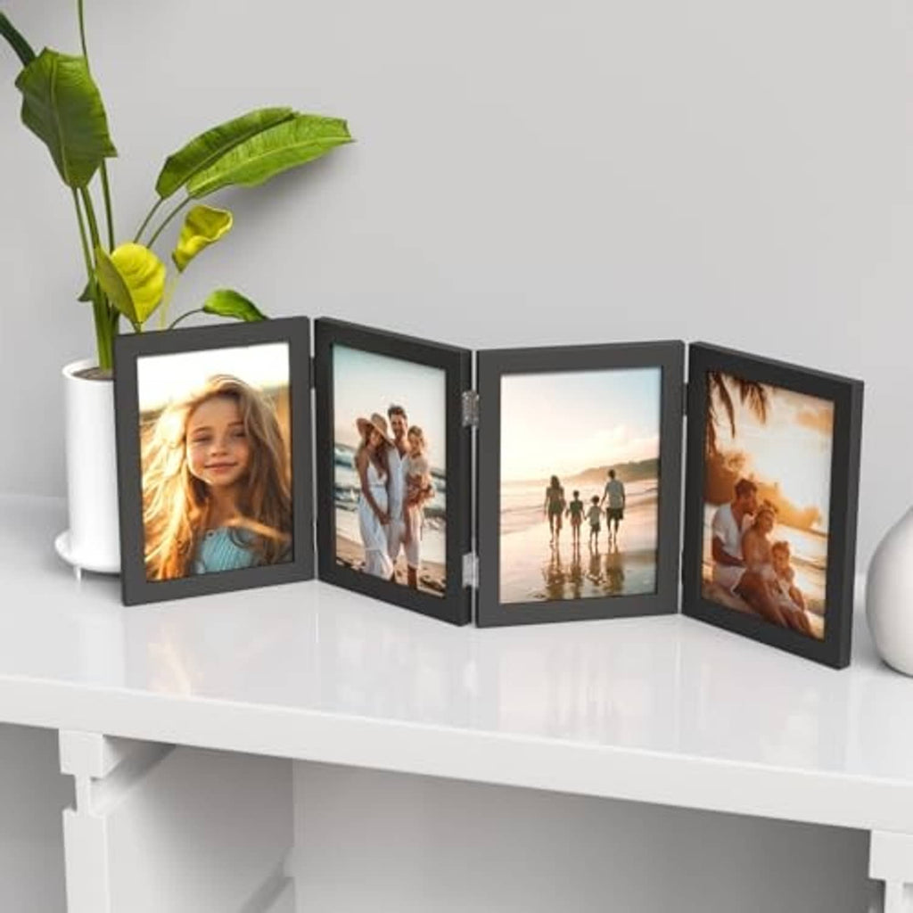 Black 4-photo folding picture frame with four hinged panels on a shelf