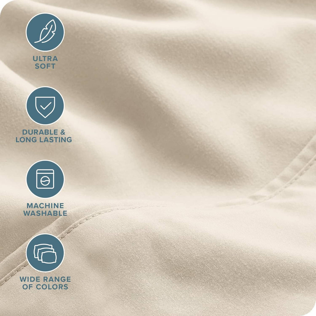 Cream microfiber sheet fabric close-up with smooth, wrinkle-resistant texture