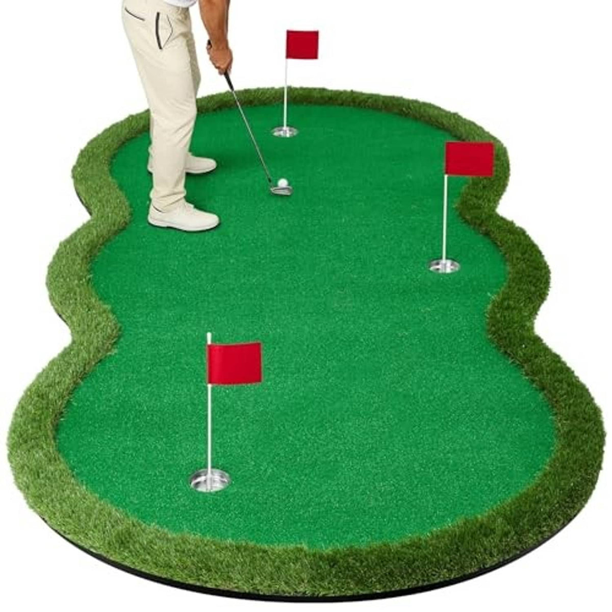 Green putting mat with four red flag hole targets and golfer practicing stance