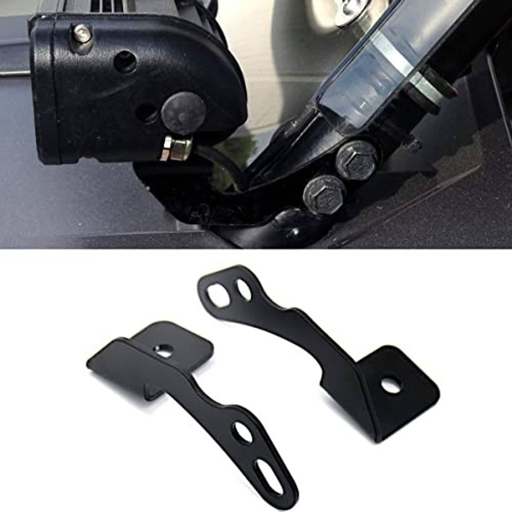 Black mounting bracket with bolts attached to the vehicle frame