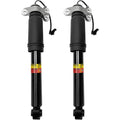Pair of black rear shock absorber struts with mounting brackets and sensor wires