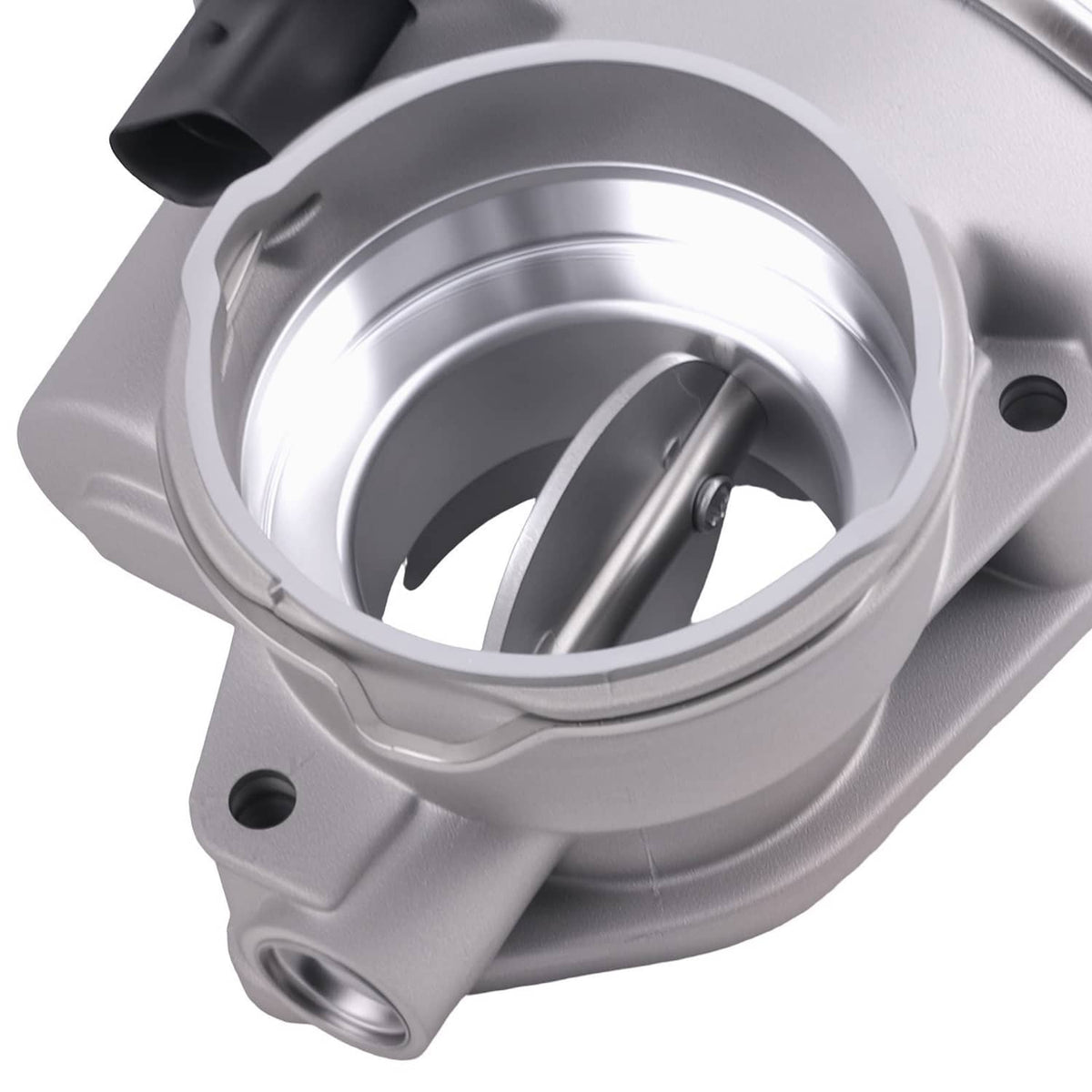 Silver throttle body with round bore and visible valve shaft inside