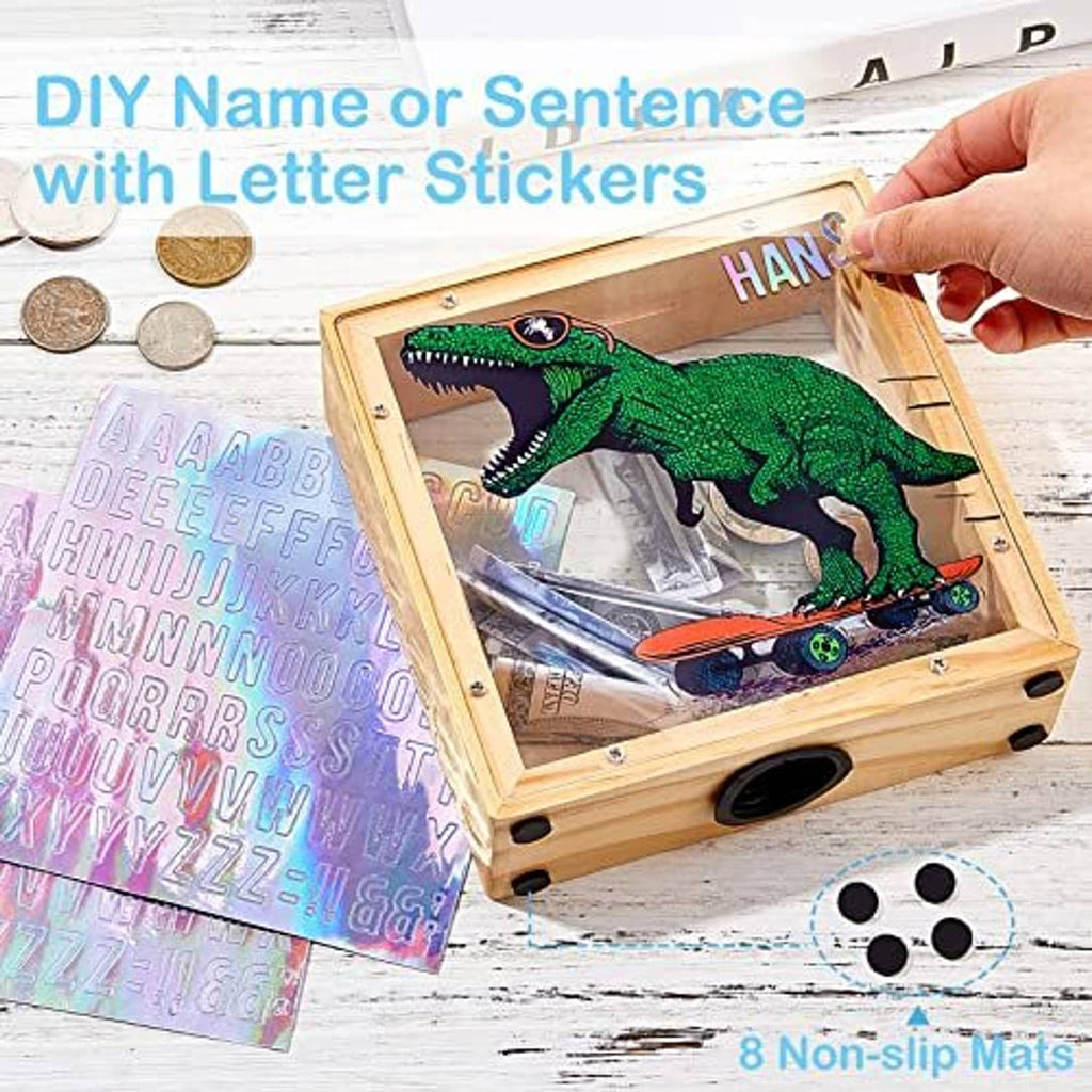 Wooden piggy bank with dinosaur image and letter-sticker name, coin slot on top