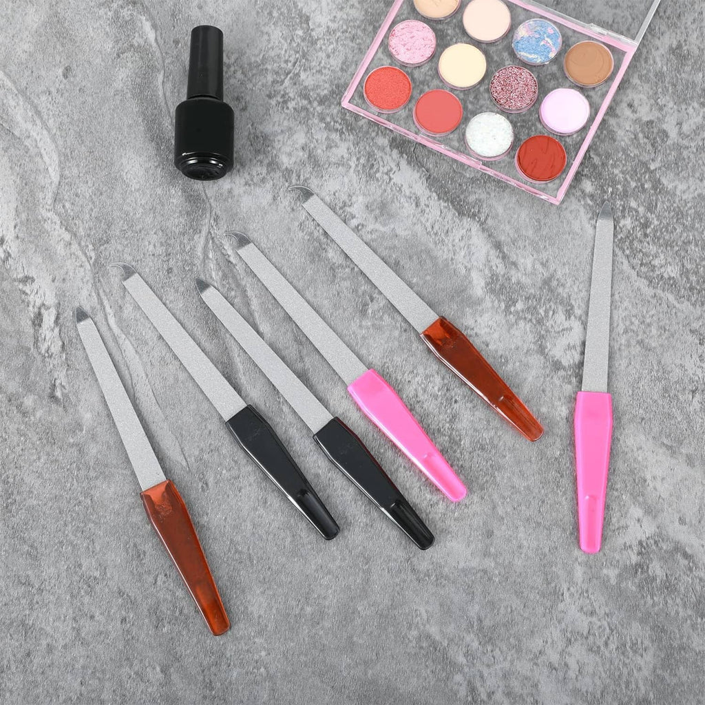 Six metal diamond nail files with assorted orange, black, and pink handles, arranged on a surface.