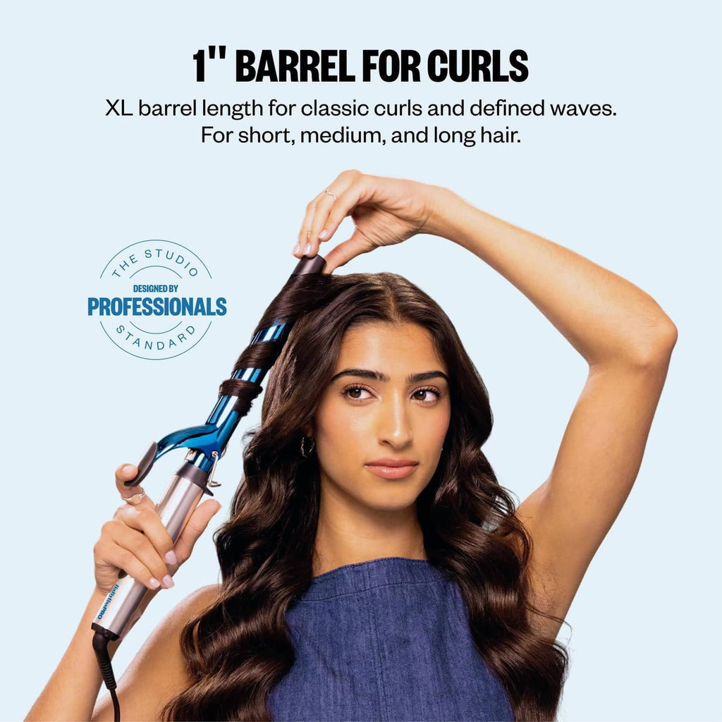 BaBylissPRO 1-inch curling iron held near long wavy hair