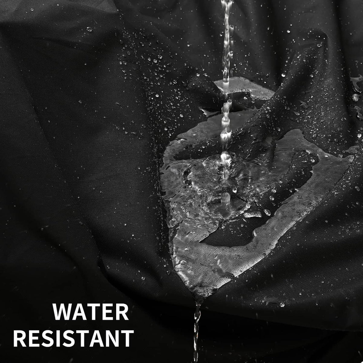 Black water-resistant grill cover fabric with visible water droplets on surface
