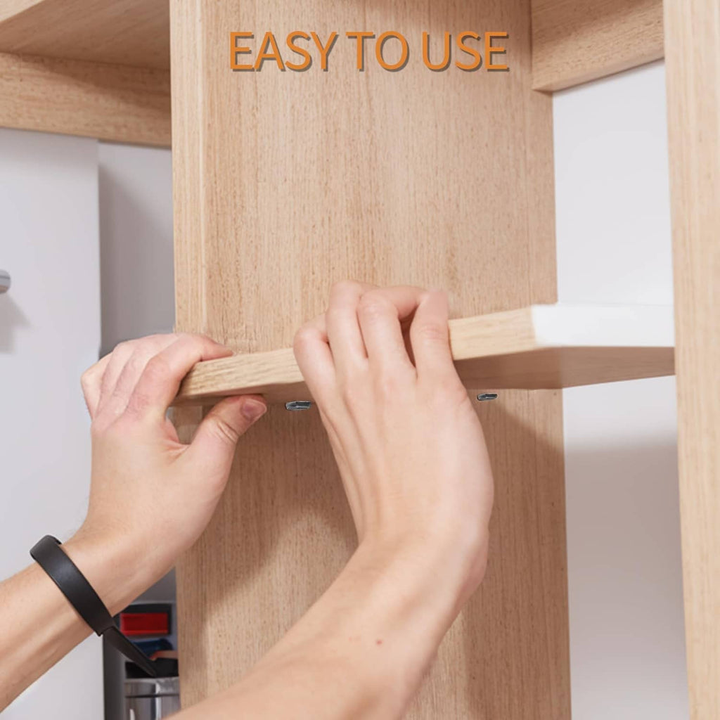 Hands installing a silver shelf peg pin into a drilled hole on a wooden board